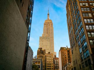 low angle photo of brown high-rise building by Vidar Nordli-Mathisen courtesy of Unsplash.